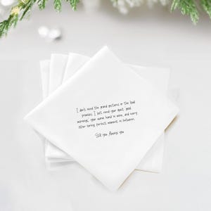 White linen napkin with printed text: "Still you. Always you."