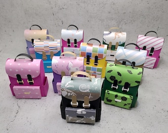 Cardboard schoolbag, gift wrapping for first day of school, schoolchild