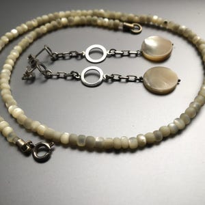 Vintage mother-of-pearl jewelry: beads necklace and stud earrings. Pearlescent jewelry. Jewelry made of mother-of-pearl (balamut), Italy.