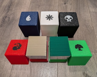 May include: Seven different colored card game boxes with various symbols on the top. The boxes are arranged in two rows, with three boxes in the top row and four boxes in the bottom row. The boxes are all the same size and shape, and they are made of a sturdy material. The symbols on the boxes include a water drop, a sun with rays, a skull, a flame, a tree, and two boxes with a striped pattern.