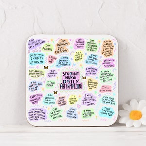 May include: White coaster with colorful text and illustrations. The text reads "Student Nurse Daily Affirmations" and includes positive affirmations such as "I am doing my best everyday" and "I will nurture myself so I have the energy to nurture others".