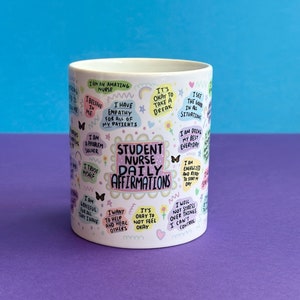May include: White ceramic mug with a colorful design featuring the text "Student Nurse Daily Affirmations" and positive affirmations for student nurses.