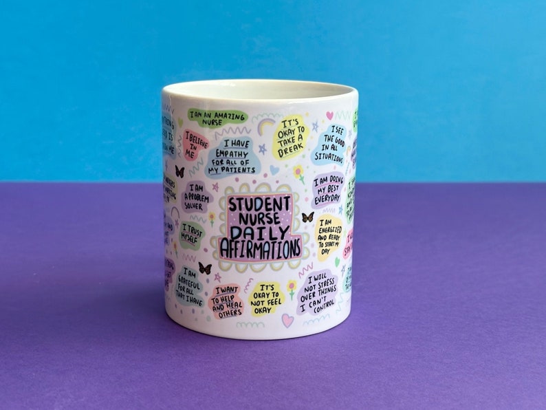 May include: White ceramic mug with a colorful design featuring the text "Student Nurse Daily Affirmations" and positive affirmations for student nurses.