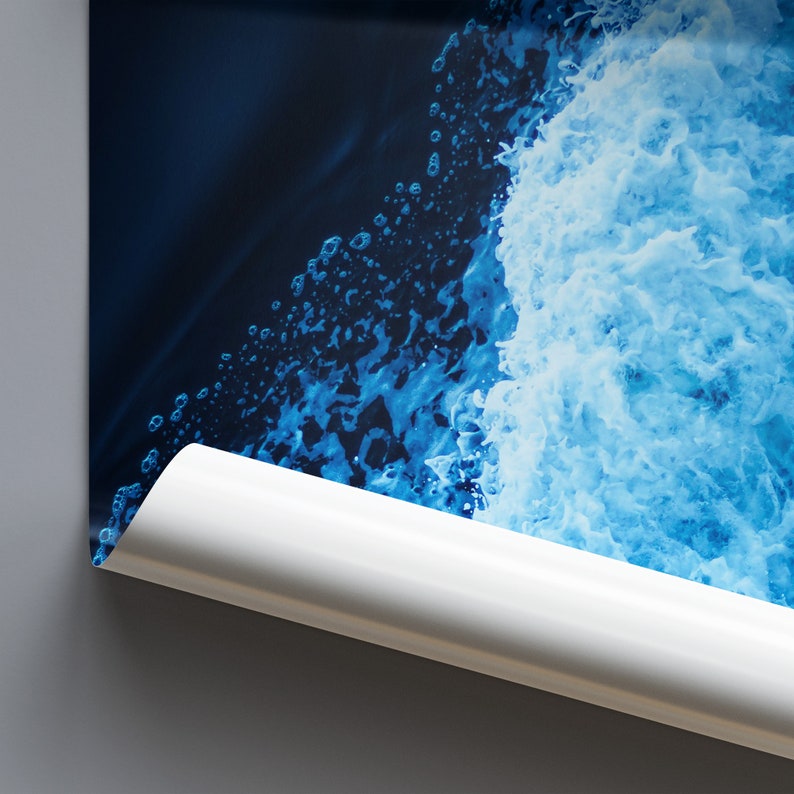 May include: A close-up of a blue and white abstract painting. The painting features a swirling pattern of blue and white paint, creating a sense of movement and energy.