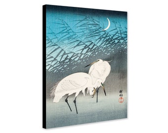 May include: Two white egrets stand in a blue and gray landscape with a crescent moon in the background. The egrets are facing each other and their necks are curved. The image is a Japanese woodblock print.