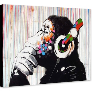 May include: A black and white illustration of a monkey wearing colourful headphones against a white background with colourful paint splatters.