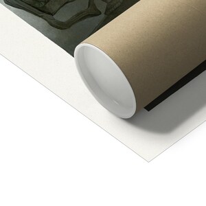 May include: A rolled up print of a black and white illustration of a skull with a crown on top. The print is rolled up in a brown cardboard tube.