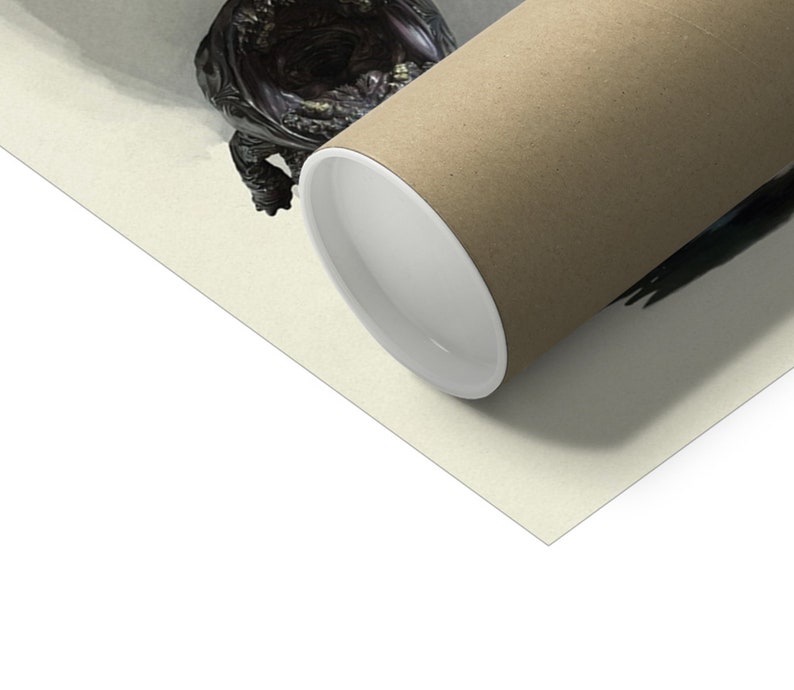 May include: A rolled-up poster with a brown exterior and white interior, resting on a light beige surface. A dark, ornate sculpture is partially visible in the upper left corner. The poster's cylindrical shape is prominent.