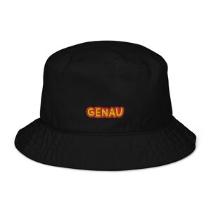 May include: Black bucket hat with a red and yellow embroidered word "GENAU" on the front.