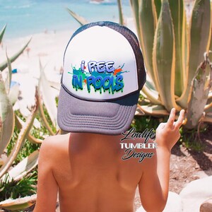 May include: A white and black trucker hat with a colorful graphic that says "I pee in pools". The hat is worn by a child standing in front of a green plant.