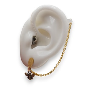 Gold bee hearing aid, listening device stud earrings for retention with safety chain. Anti-loss, functional jewellery for pierced ears.