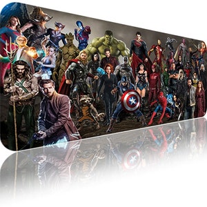 May include: A colourful graphic design featuring a large group of superheroes, including Iron Man, Captain America, Thor, Hulk, Spiderman, and many more. The design is perfect for a mouse mat or a decorative piece for a fan of superhero films.