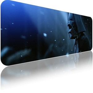 May include: A dark blue background with a black silhouette of Darth Vader standing in the snow. The image is a digital illustration.