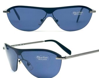 Calvin Klein 1010 Oval Silver Metal Sunglasses W Black Cello  display picture 3