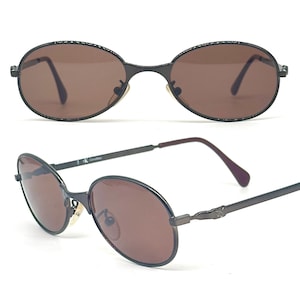 Calvin Klein 2004 gunmetal oval shaped sunglasses made in Italy, 90s NoS