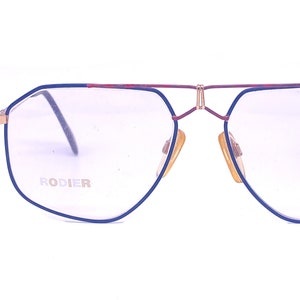 Rodier W Germany golden metal aviator with red/blue enameled and cutoff details, NOS 80s