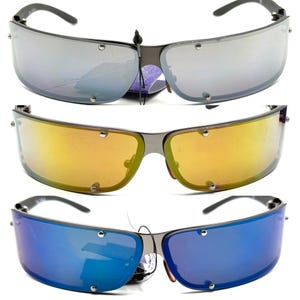 May include: Three pairs of sunglasses with a wraparound design. Each pair has a different lens color: silver, gold, and blue. The frames are a dark metallic color, and the lenses are attached with small silver rivets.