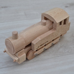 Varnished locomotive toy in natural beech wood for children over three years old