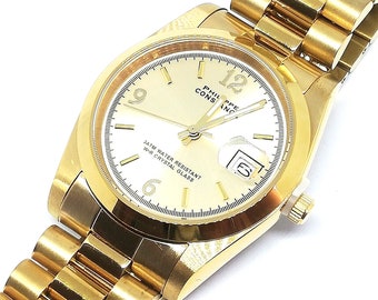 Montre Femme ERNEST à Quartz, Cadran Chiffres Romains Rose Gold, Bracelet Cuir Marron - Classique Et élégante