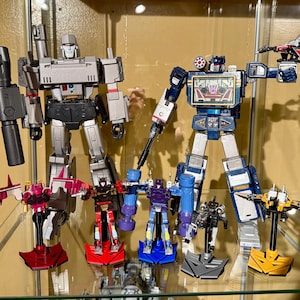 Soportes para casetes de Masterpiece Transformers