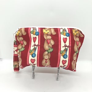 Small zipper pouch for sock knitting, holding needles, yarn, pattern. Handcrafted with gingerbread fabric .