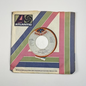 May include: Vintage vinyl record sleeve with the Atlantic Records logo in purple and black. The sleeve has a striped design in pink, green, and blue. The record label is Windsong, featuring the text "STARLAND" and "STARLAND VOCAL BAND".