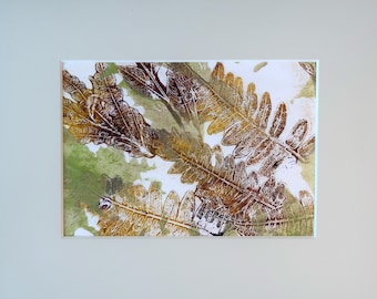 A monoprint from Gelli print, "Ferns", matted.