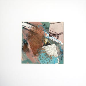 A unique mono-print with collaged elements, matted and ready to frame.