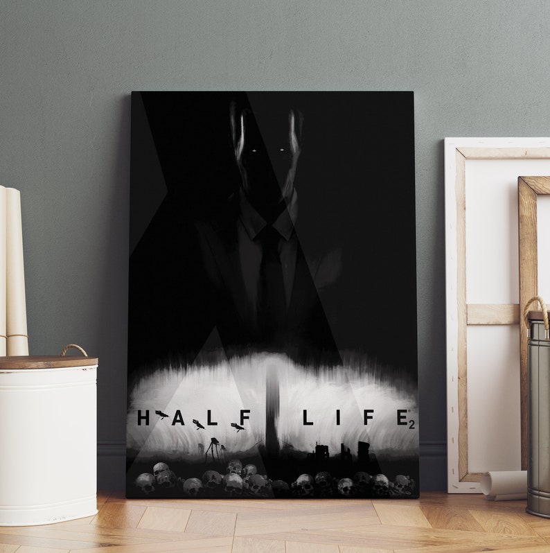 May include: A black and white digital art print of a shadowy figure with the text "HALF LIFE 2" at the bottom. The figure is wearing a suit and tie and is standing in front of a city skyline.
