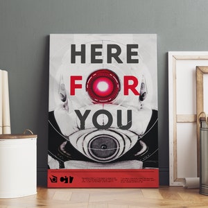 May include: A black and white poster with the text "HERE FOR YOU" in red and black letters. The poster features a robot with a red eye and a large speaker. The poster is a promotional image for the video game "BioShock".