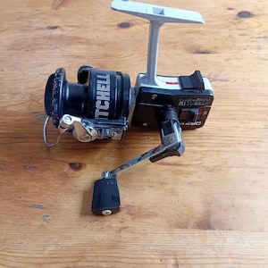 Vintage Mitchell 4450 Spinning Reel in excellent working condition.
