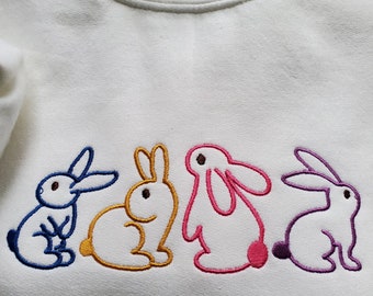 Sudadera unisex con conejitos bordados