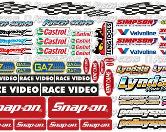 May include: A collection of colorful decals featuring various sponsors and logos, including Speedworth Motorsports, Castrol, Gaz, Race Video, Snap-on, Lyndale Race Engines, and Spax. The decals are printed on white backgrounds and feature a variety of fonts and colors.