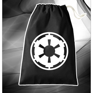 May include: Black drawstring dice bag featuring a white Imperial symbol from Star Wars. The bag is made of fabric and has a drawstring closure. DICE BAGS is written in red letters at the bottom of the image.