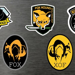 Set di adesivi in vinile Metal Gear Solid - Solid Snake Liquid MGS Fox found FOX XOF Militiares sans frontiers Diamond Dogs
