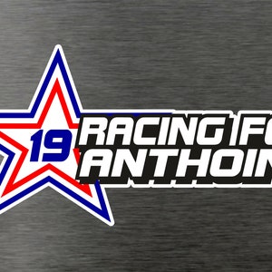 May include: A red, white, and blue star with the number 19 inside. The text "Racing for Anthoine" is in black with a white outline.
