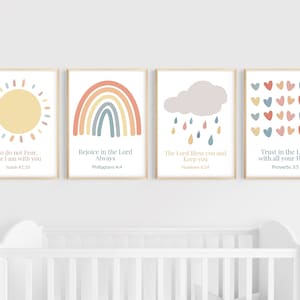 May include: Four framed prints with colorful illustrations and bible verses. The prints feature a sun, a rainbow, a cloud with raindrops, and a pattern of hearts. The verses are "So do not Fear, for I am with you Isaiah 41:10", "Rejoice in the Lord Always Philippians 4:4", "The Lord Bless you and keep you Numbers 6:24", and "Trust in the Lord with all your Heart Proverbs 3:5".