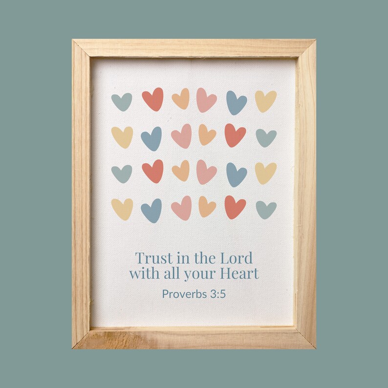 May include: A framed print with a white background and a colorful heart pattern. The print includes the text "Trust in the Lord with all your Heart" and "Proverbs 3:5".