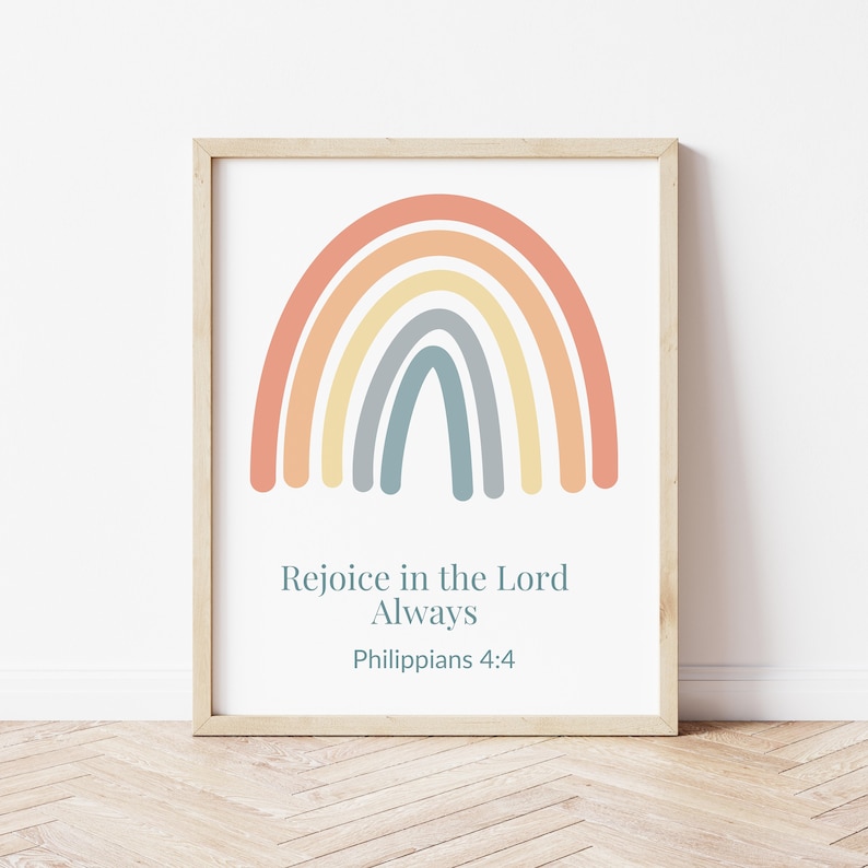 May include: A framed print with a rainbow in pastel colors and the text "Rejoice in the Lord Always Philippians 4:4".