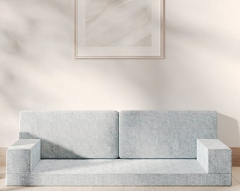 Sofá cama modular personalizado con cojín de espuma y diseño personalizable.