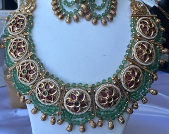 Beautiful Rajwadi necklace set with kemp stone, green crystals and pearls.
