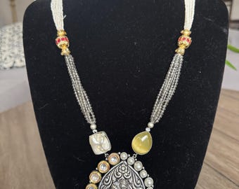 Beautiful kundan and baroque pearl set with semiprecious pearls and yellow beads