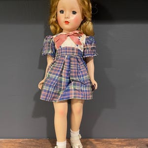 Vintage Doll 1950s, Made in USA, Hard Plastic with Jointed Limbs, Strawberry Blonde Hair and Blue Eyes, Plaid Dress with Bow, 14” Tall