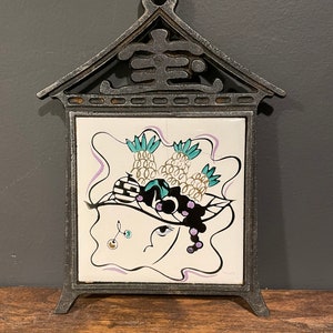 Vintage Japan Trivet: Iron Pagoda, Graphic Woman with Fruit Hat