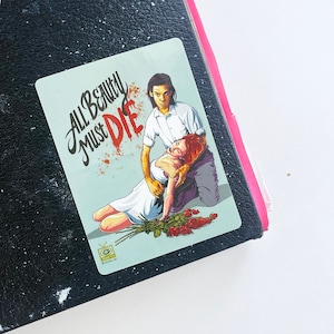 May include: A sticker with a graphic illustration of a man and a woman. The man is wearing a white shirt and the woman is wearing a white dress. The woman is lying on the ground with her eyes closed. The man is standing over her with his hand on her shoulder. The text "All Beauty Must Die" is written in a stylized font in red and black. The sticker has a blue background.
