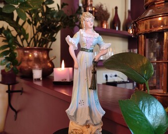 Porcelain figurine of a young woman in 1907 dress with a fan, Germany, A.W.F. Kister.