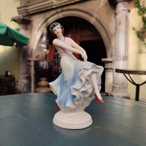 A sweet-faced and mesmerizing statuette of a dancer in the Art Deco style, Carl Schneiders Erben, 1886-1952.