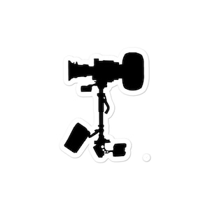 May include: A black silhouette of a camera mounted on a tripod with a wheel on the side.