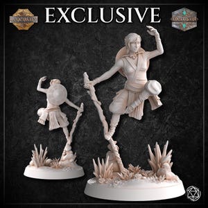 May include: A white painted miniature figurine of a female character in a fighting pose, holding a staff. The figurine is standing on a base with a rocky terrain and foliage. The figurine is labeled "Exclusive".