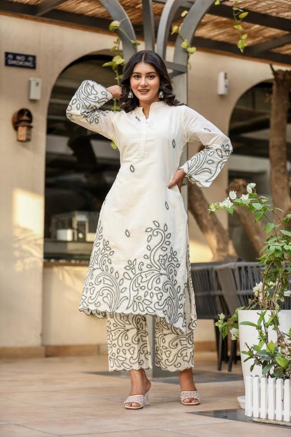 Shopsy Ethnic Wear: Styles, Fabrics, Sizing & Smart Buying Guide (2026) Women’s white cotton rayon kurta pant set with intricate black embroidered designs